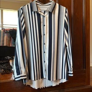 Women’s loose fit button down collared shirt.